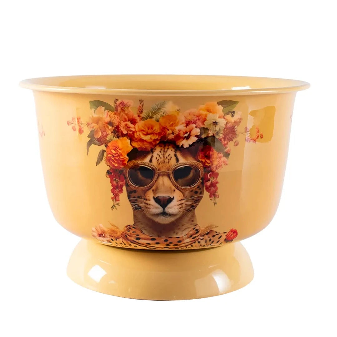 A yellow enamel bowl with a decorative illustration of a leopard wearing sunglasses and a flower crown, set against a plain white background.